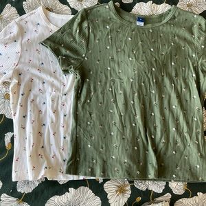 Baby doll tees with floral design. Green and white. Like new condition.